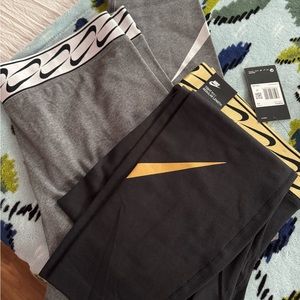 Nike two pairs of metallic leggings size XXL